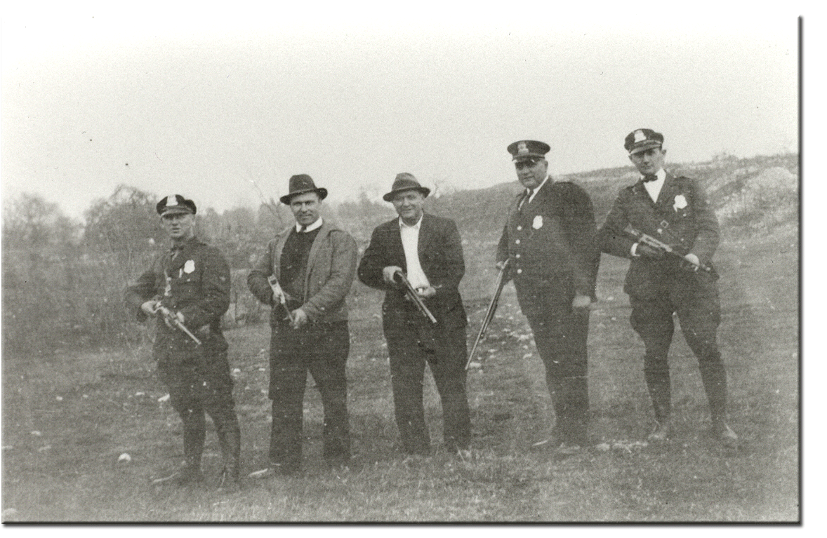 Police Chief August Frank (4th from left) with other unidentified law enforcement officers – Date unknown